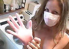 Dental assistant puts gloves mask