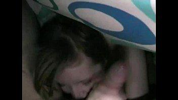 Girl gives boy handjob under covers