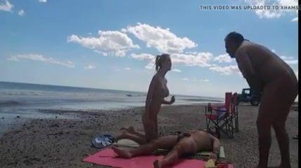 Blonde woman masturbate dick on beach